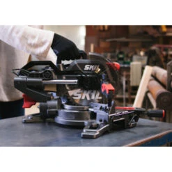 SKIL Afkortzaag / Verstekzaag 216mm Met Trekfunctie En Laser 1310AA 1600W + Snelklem 18 SKIL Afkortzaag / Verstekzaag 216mm Met Trekfunctie En Laser 1310AA 1600W + Snelklem -Gamma 123 73